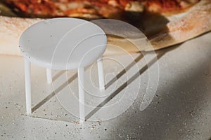 White plastic pizza table