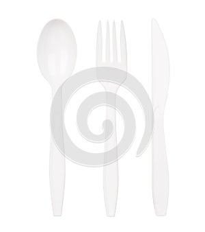 White plastic spoon, fork and knife isolated on white