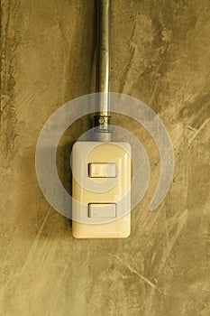 White plastic switch panel is on loft style wall