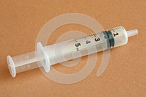 White plastic syringe