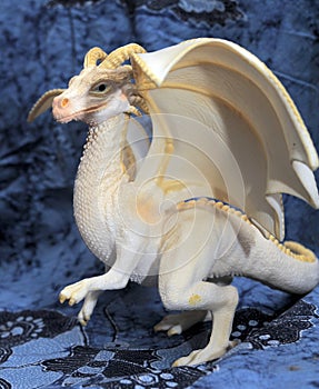 White plastic toy dragon