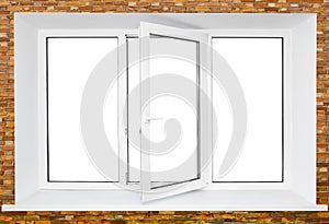 White plastic triple door window on brick wall