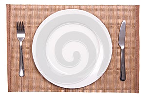 White plate on a bamboo mat