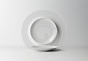 White Plate and Bowl on Textured White Background