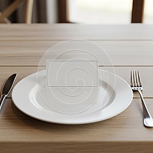 A white plate is centered on a wooden dining table. On the plate, a blank, rectangular
