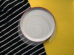 White plate on colored background