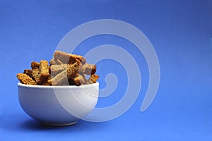 White plate with crackers with seasoning appetizer