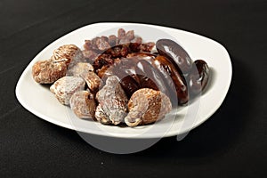 White plate with dried fruits