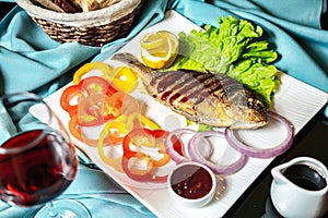 White Plate With Fish and Vegetables