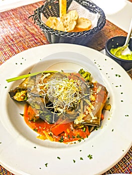 White plate with gourmet vegetarian dish meal in restaurant Mexico