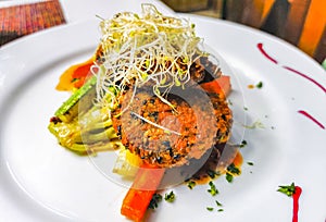 White plate with gourmet vegetarian dish meal in restaurant Mexico