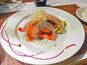 White plate with gourmet vegetarian dish meal in restaurant Mexico