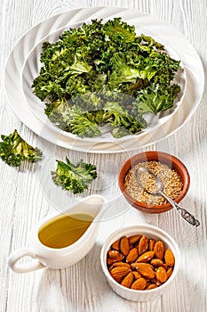 White plate with kale chips on the table