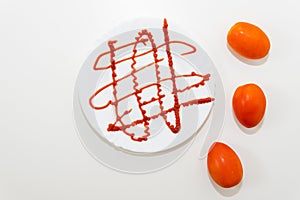 White plate with ketchup sauce. Tomato sauce concept.