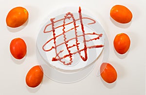 White plate with ketchup sauce. Tomato sauce concept.