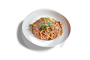 White plate with ragu sauce on Linguine