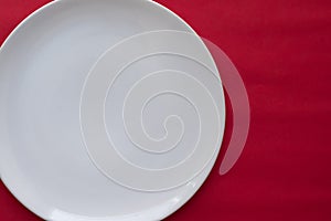 White plate on red background