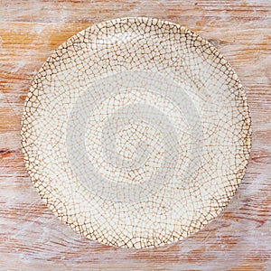 White plate on wooden table