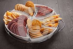 White Platter of Crackers, Cheese, Meat horizontal shot