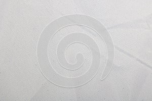 White pleated fabric closeup, texture or background