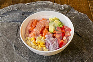 White Poke Bowl with cubes of Norwegian salmon, sweet corn, pieces