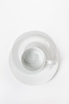 White porcelain cup and saucer for cappuccino and coffee isolated on a white background