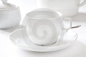 White porcelain cup with souÑer