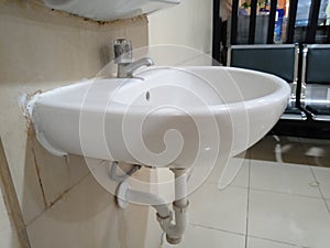 White porcelain sink in public restroom