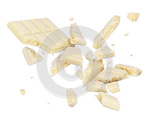 White porous chocolate broken into pieces in the air