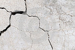 White porous stone with cracks. Stone texture background. Cracked concrete wall texture