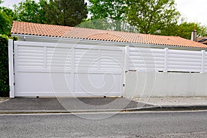 White portal suburb metal modern gate white fence on home suburb street access door house garden