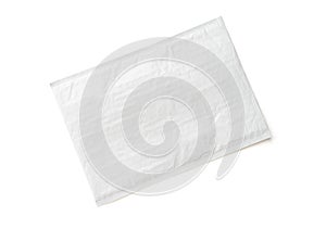 White postal package. Plastic parcel object background for online shopping advertising. Isolated on white background with clipping