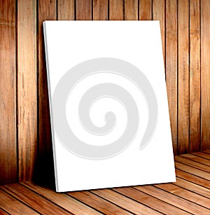 White poster frame in wooden room,mock up for your content