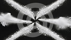 White powder exploding on a black background creating an x shape