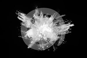 White powder explosion on black background.