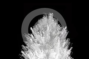 White powder explosion on black background.