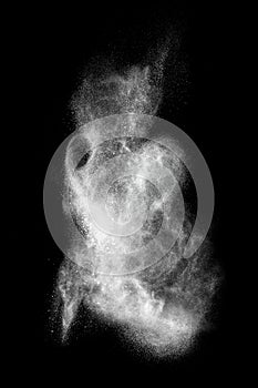 White powder explosion isolated on black