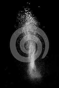 White powder explosion isolated on black