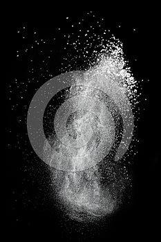 White powder explosion isolated on black