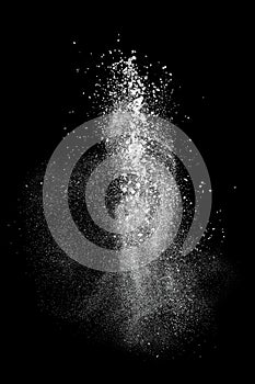 White powder explosion isolated on black