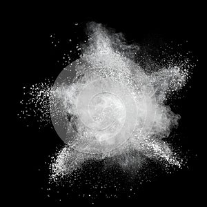 White powder explosion isolated on black