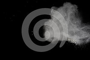 White powder explosion isolated on black background