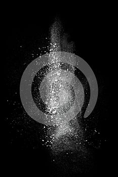 White powder explosion isolated on black