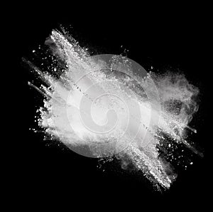 White powder explosion isolated on black background