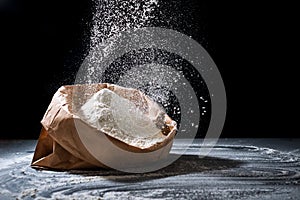 White powder splash  on black background. Flour sifting on a black background. Explosive powder white flour