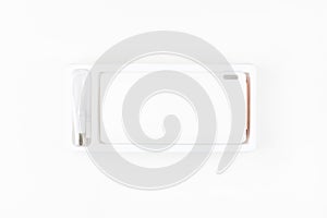 white power bank for charging smartphones and various digital devices on a white background