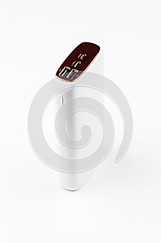 white power bank for charging smartphones and various digital devices on a white background