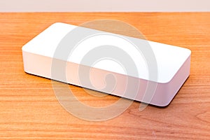 White power bank on wooden table