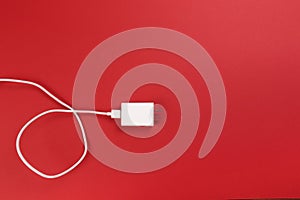 White power cable socket on red background