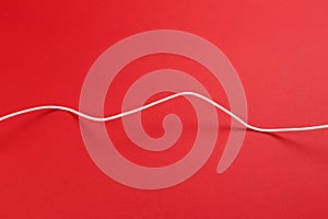 White power cable socket on red background